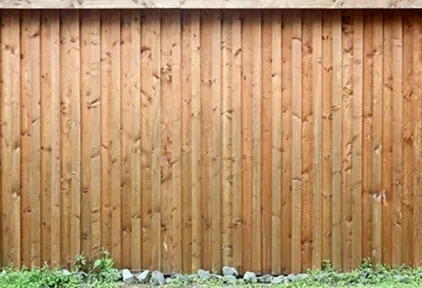 Tall natural wood privacy fence